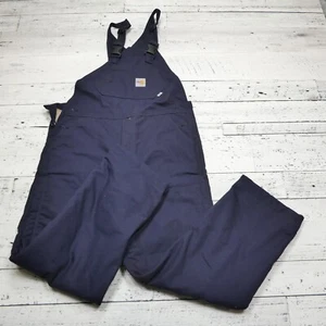 Mono Carhartt FR resistente al fuego talla 32x32 babero de lona azul marino aislado - Imagen 1 de 9