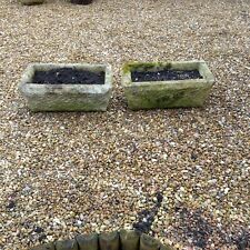 A pair of vintage concrete stone garden planter troughs