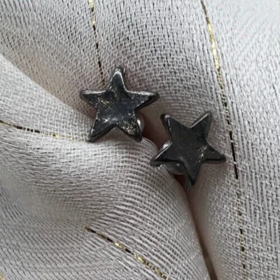 Pendientes perforados estrella de peltre Foto 1 de 4