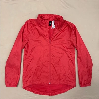 Chaqueta cortavientos Adidas coral con capucha oculta para mujer talla pequeña Foto 1 de 4