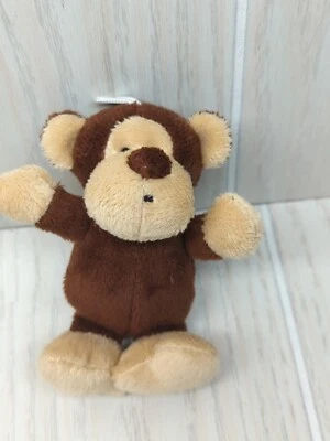 Pequeño peluche mini marrón tostado beige mono sonajero peluche bebé juguete blanco cabeza lazo Foto 1 de 4