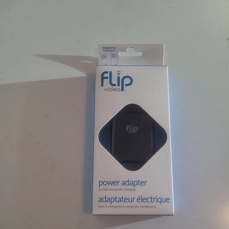 Nuevo adaptador de corriente Flip Video APA1B para carga rápida de videocámara Foto 1 de 3