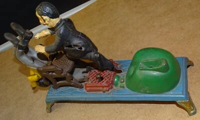 Cast Iron Bank Dentist Pulling Tooth (Book of Knowledge) - Image 1 of 4