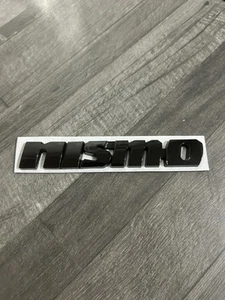 1 X Nismo Full Gloss Black rear boot 3d badge, metal 120mm x 18mm *DAMAGED* - Picture 1 of 4