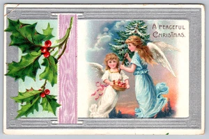 Postcard A Peaceful Christmas Angels Apples Tree Holly Blue Silver Embossed - Picture 1 of 2