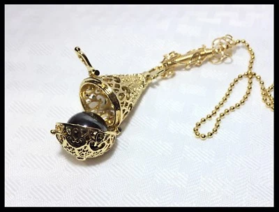 Medallón artesanal de oro rosa baratija hematita piedras preciosas semipreciosas abanico tirar Foto 1 de 4