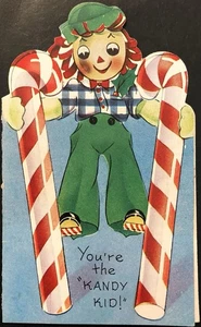 Vtg Christmas Greeting Card Adorable Raggedy Doll On Candy Cane Stilts Kandy Kid - Picture 1 of 3