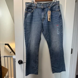 Neu mit Etikett Levi's Kick Flare Jeans kurz knöchelhoch abgeschnitten roher Saum mittelblau hohe Taille 32 - Bild 1 von 9