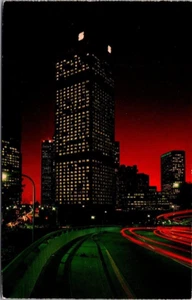Los Angeles, California CA BUSY FREEWAY and BUILDINGS night view Postcard - Picture 1 of 2