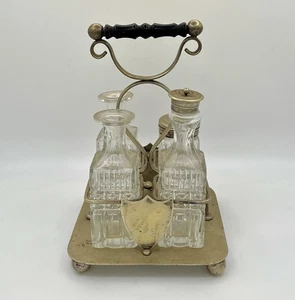 Antiguo juego de ruedas victorianas EPNS Cruet botellas de vidrio prensado soporte plateado - Imagen 1 de 16