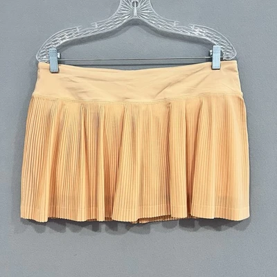 Falda corta Lululemon para mujer 10 naranja plisada a la calle II tenis pickleball Foto 1 de 4