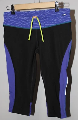Leggings Capri Cortos Lucy Tech Talla Mediana Negro Azul Teal Pantalones Cortos Foto 1 de 4