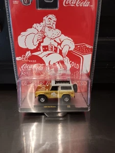 1/64 M2 Machines 2025 Coca-Cola Christmas 1966 Gold Ford Bronco - Picture 1 of 5