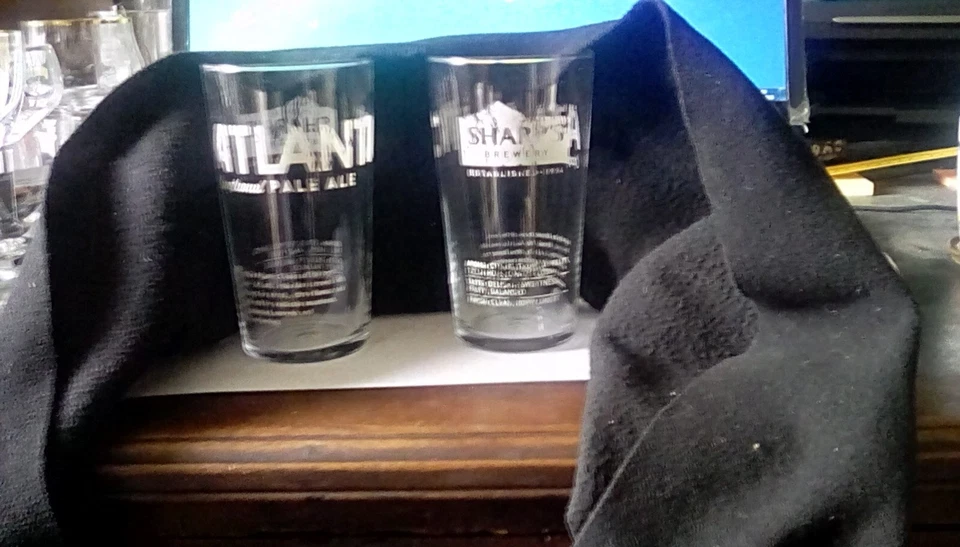 TWO SHARP'S ATLANTIC PINT GLASSES ROCK BREWERY CORNWALL A BIT WORN IN KEEPING - Image 1 of 1