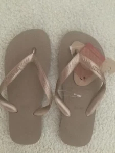 Havaiana flip flops  glossy gold/tan  tags on newsize 37-38 like a 7 size - Picture 1 of 3
