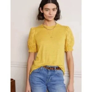 Camiseta Boden Broderie de lino con ojales manga abullonada amarilla para mujer 6 - Imagen 1 de 13