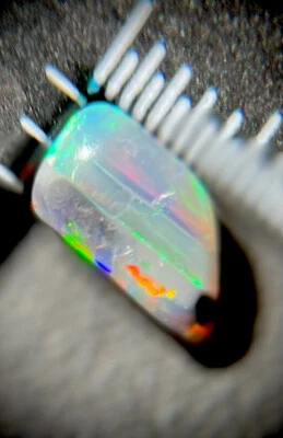 0.5TCW Australian Opal, Lightning Ridge Semi-Black. Ribbon Orange/Green/Purple - Image 1 of 4