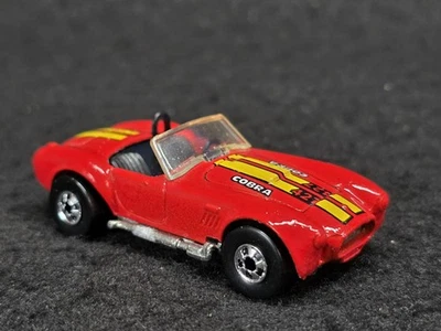 Cobra clásica Hot Wheels 1985 lanzamiento con paredes negras y 427 en capó Foto 1 de 4