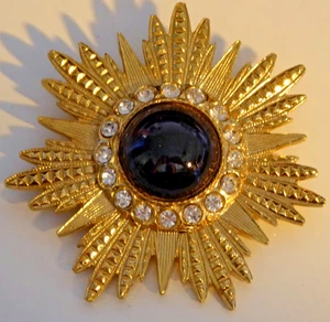 Large Sun Brooch Shiny Gold Tone Black Glass Center Ringed by Clear Rhinestones - Picture 1 of 2