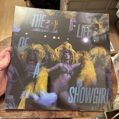 Taylor Swift: THE LIFE OF A SHOWGIRL: BABY, THAT‘S SHOW BUSINESS EDITION (BLUE) - Image 1 of 3