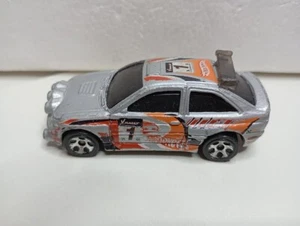 MODELLINO AUTO DIE CAST-FORD ESCORT RALLY-SCALA 1/64-HOTWHEELS-1996-MALAYSIA - Foto 1 di 8