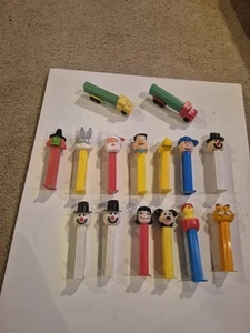 15 Stück Pez Spender Feuersteine Garfield Mickey Charlie Braun - Bild 1 von 9