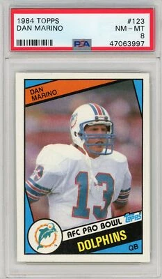Tarjeta de fútbol americano de radiocontrol Topps Dan Marino #123 1984 graduada PSA 8 casi nueva-como nueva Foto 1 de 2
