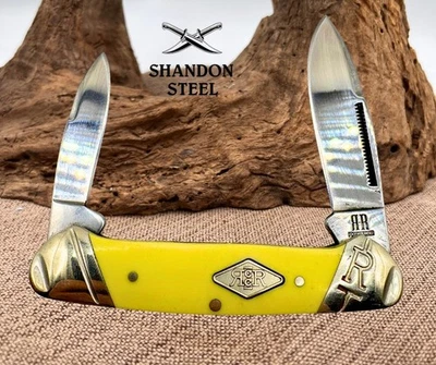 Rough Rider Yellow Canoe RR1736 Stainless Synthetic Folding Pocket Knife (32) - Image 1 of 4