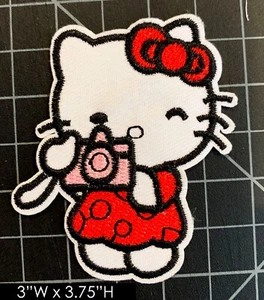 Hello Kitty Photographer Embroidered Iron On Patch - Picture 1 of 3