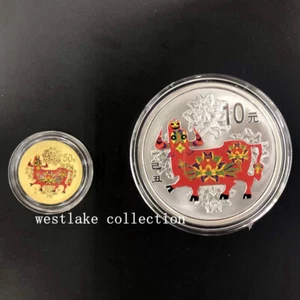 2009 China 50Yuan+10Yuan Lunar Series OX 1/10oz Gold+1oz Silver Colored Coin - Picture 1 of 3