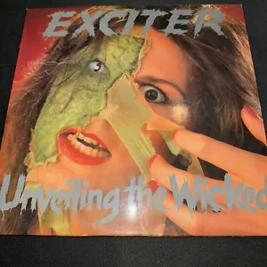 Exciter - Unveiling The Wicked (Rare 1986 LP Vinyl Combat Records Green Label) - Foto 1 di 9
