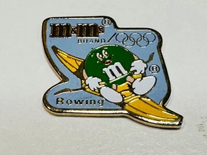 1992 Summer Olympic XXV Lapel Vest Hat Pin Barcelona Ms. Green M&M Mars Rowing - Picture 1 of 2