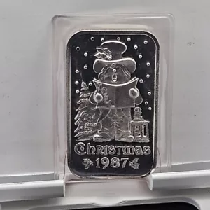 Madison Mint Christmas 1987 Noel Caroling Kid 999 Fine Silver One Troy Ounce Bar - Picture 1 of 6