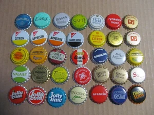 35 NOS AUSLÄNDISCHE INTERNATIONALE SODA WASSERFLASCHENVERSCHLÜSSE SODA KRONEN MEIST VERALTET - Bild 1 von 5