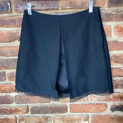 Minifalda para mujer Naf Naf Paris negra plisada con ribete de encaje cremallera lateral talla 36 EE. UU. 8 Foto 1 de 4