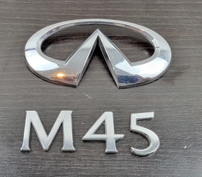 Infiniti M45 84890-EH100 2006-2008 emblema tapa maletero OEM Foto 1 de 4