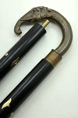 Bastón de madera con mango de cabeza de elefante acabado antiguo bastón de diseñador náutico Foto 1 de 4