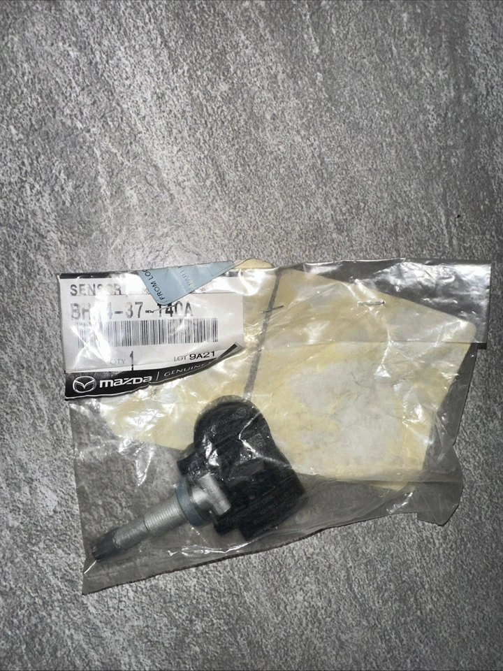 Sensor de presión de neumáticos genuino Mazda TPMS BHA4-37-140A OEM Foto 1 de 2
