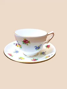 Taza de té y platillo Crown Staffordshire Rose Pansy Inglaterra floral vintage - Imagen 1 de 4