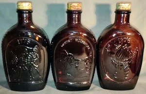 Set of 3 Log Cabin Syrup Bottles Mt Rushmore 1776 Bicentennial Brown Glass &Lids - Picture 1 of 7
