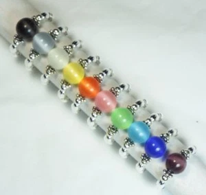 ANILLOS ELÁSTICOS SOLITARIO OJO DE GATO CYNTHIA LYNN "EYE CANDY" PLATA ESTERLINA - Imagen 1 de 11