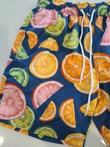 Get ready to hit the waves with these colorful Surfclub swim trunks! - Picture 1 of 10