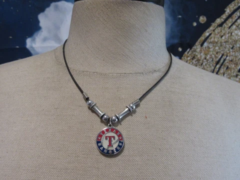 Black Cord Necklace with a Texas Rangers Pendant Marked Peter David 2005 Cover