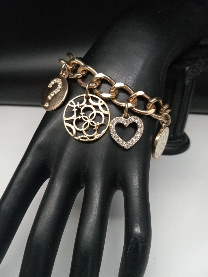 Pulsera GUESS BRAND Logotipo Tono Dorado Cristales Transparentes Esmalte Dijes Palanca Foto 1 de 4