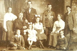 RPPC FAMILY STUDIO PORTRAIT WW1 SOLDIER UNIFORM W. GREDY REAL PHOTO POST CARD - Picture 1 of 3