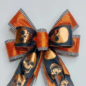 Calaveras de cobre en negro con arco metálico naranja Halloween - Imagen 1 de 2