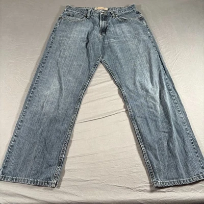 Pantalones de mezclilla Wrangler para hombre 30x28 azul calce suelto 5 bolsillos lavado medio pierna recta Foto 1 de 4