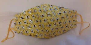 "MÁSCARA FACIAL PARA ADULTOS AMARILLA AJUSTABLE/REUTILIZABLE ABEJA CON ALAMBRE PARA NARIZ Y FILTRO" - Imagen 1 de 2