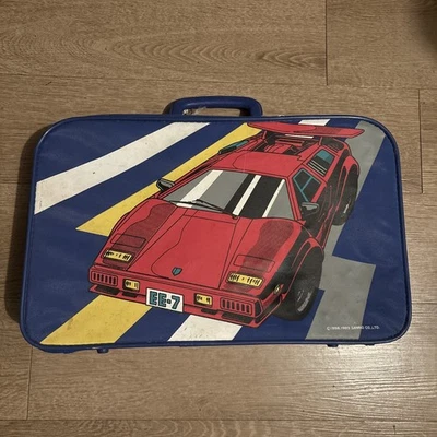 Mala pequena vintage 1988/1989 Sanrio Lambo EE-7 vermelha azul amarela masculina  - Imagem 1 de 4