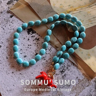 Collar Literario Chapado en Oro Pequeño Elefante Retro Piedra Turquesa Foto 1 de 4